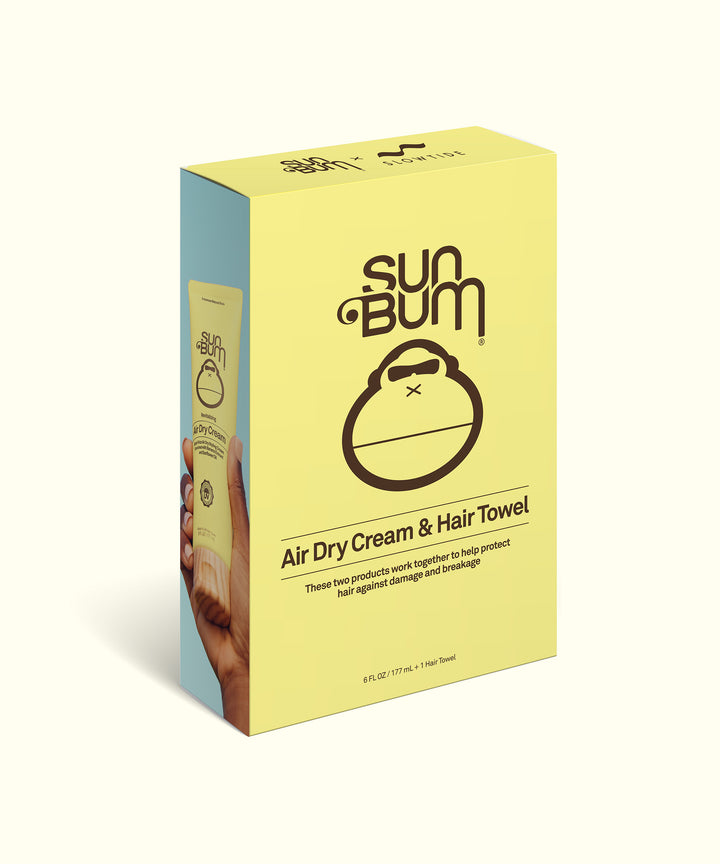 Air Dry Cream & Hair Towel Kit packaging in pastel yellow and blue colors featuring Sun Bum's signature monkey logo. Product box displaying hair care set designed to protect against towel damage. - Sun Bum