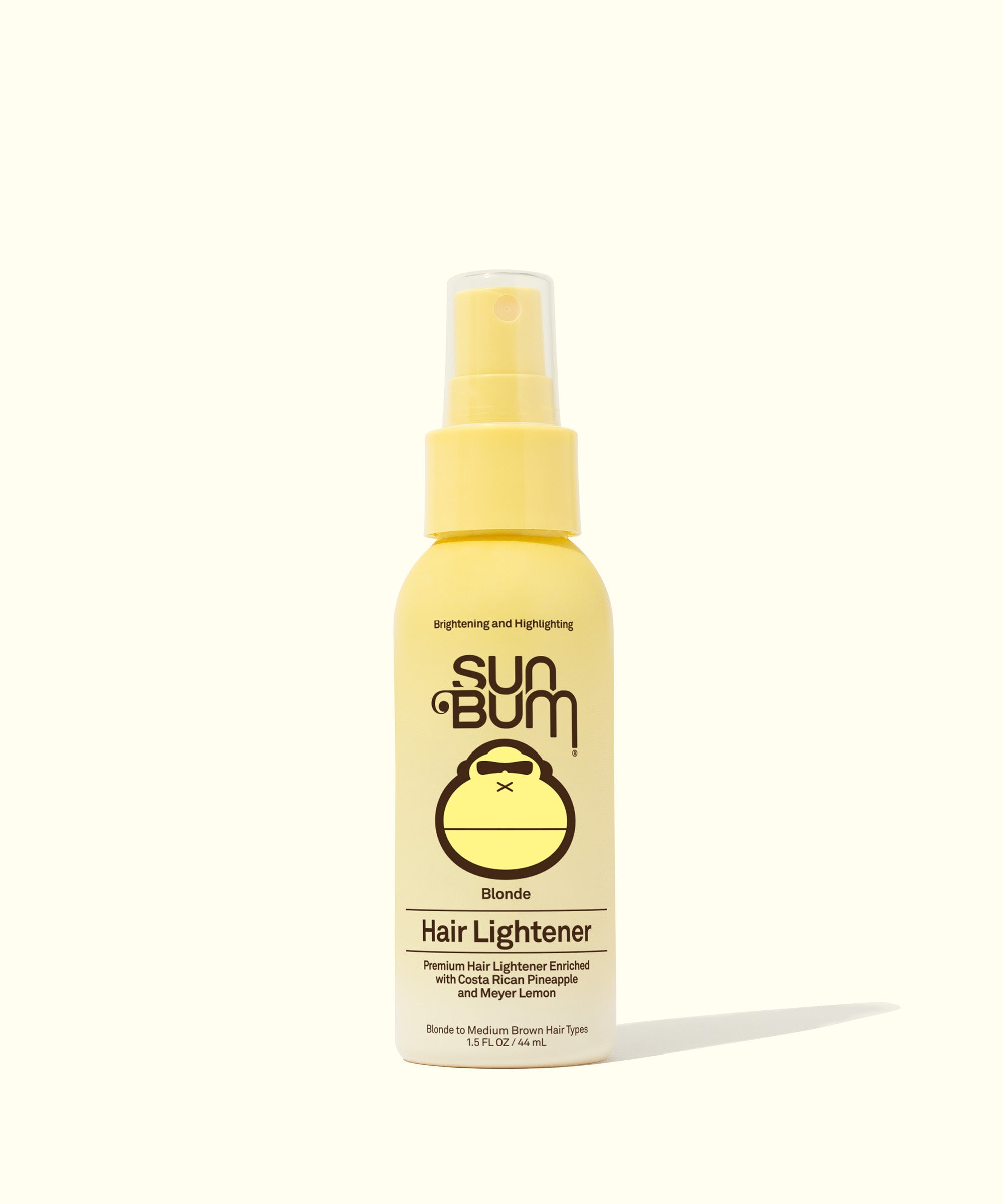 A yellow bottle of Sun Bum Blonde Hair Lightener spray made with Costa Rican Pineapples and Meyer Lemons to naturally brighten hair in the sun. Sun Bum.