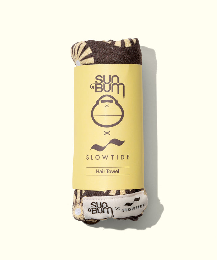 SB x Slowtide Limited Edition Hair Towel in packaging, designed to dry hair faster while protecting against frizz, breakage, and dullness. Sun Bum.
