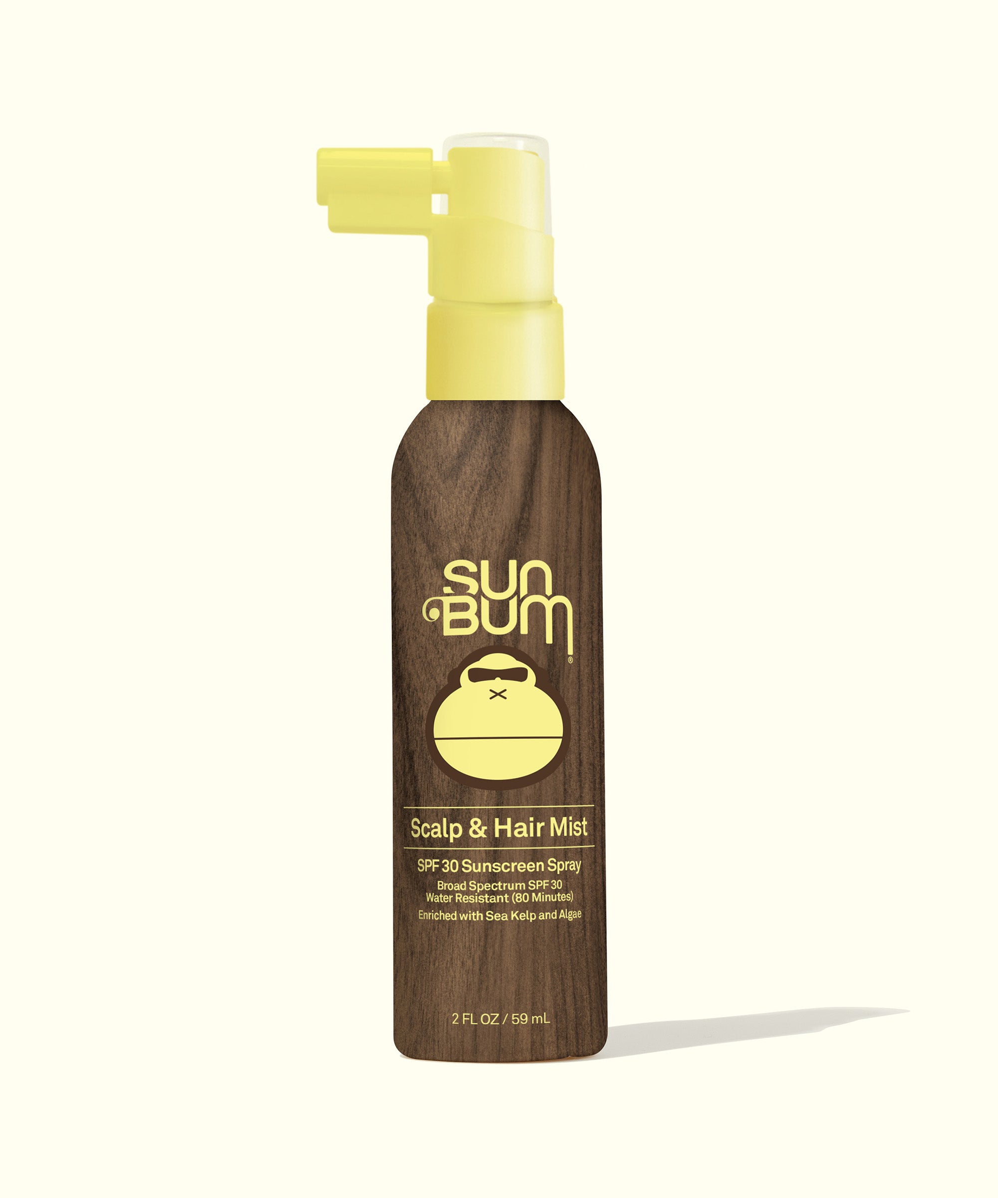 Scalp & Hair Mist SPF 30 in a sleek brown spray bottle with a yellow cap, designed for lightweight, fast-drying protection that keeps hair grease-free. Sun Bum,