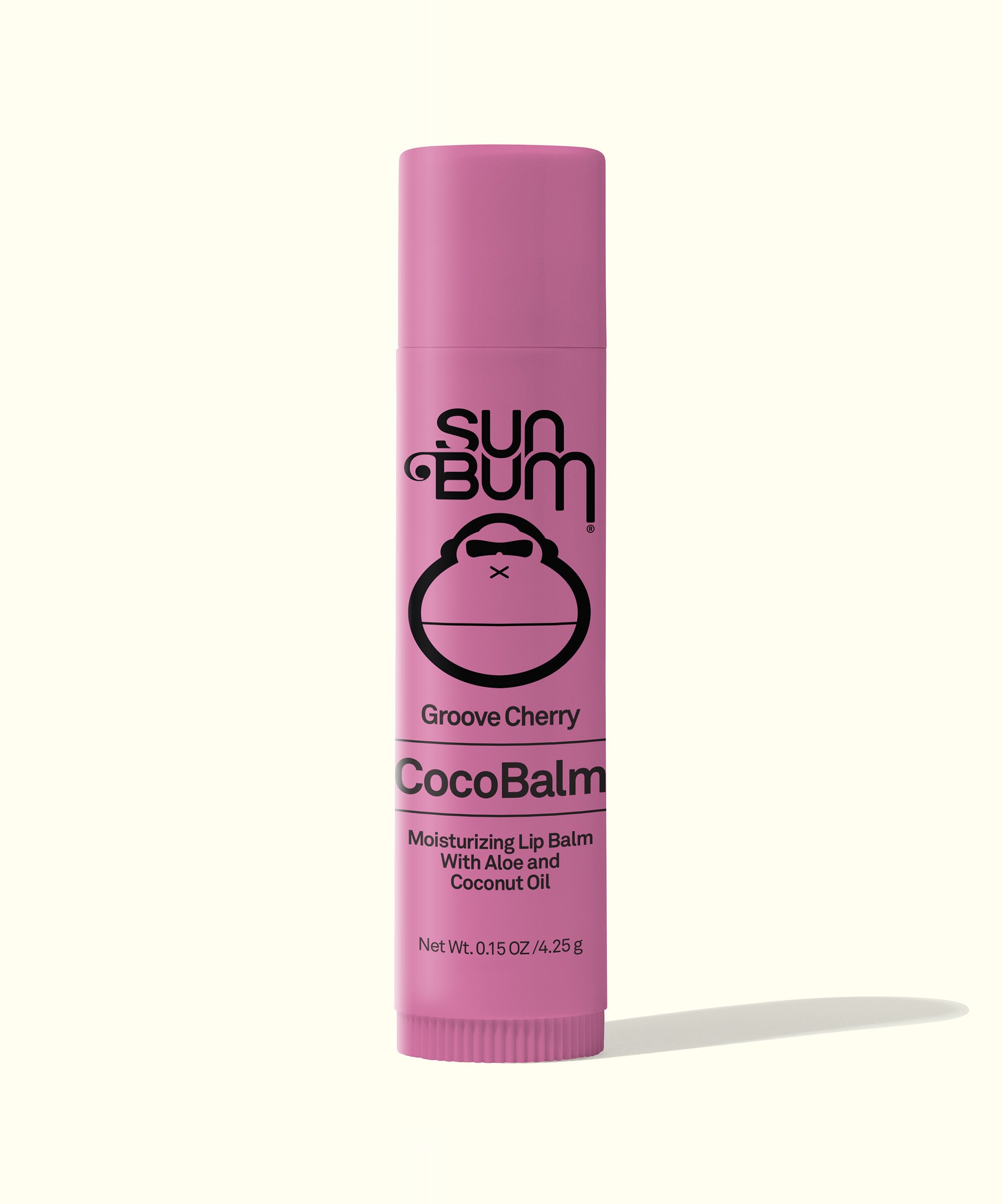 Pink tube of Groove Cherry CocoBalm Lip Balm, known as the world's greatest lip balm, featuring a moisturizing formula with aloe and coconut oil. Sun Bum