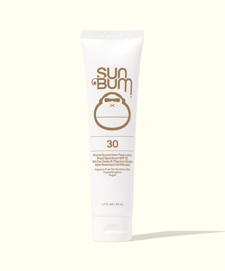 White tube of Mineral SPF 30 Sunscreen Face Lotion by Sun Bum, with Fragrance Free, non-tinted, mineral-based formula, leaving a matte finish.