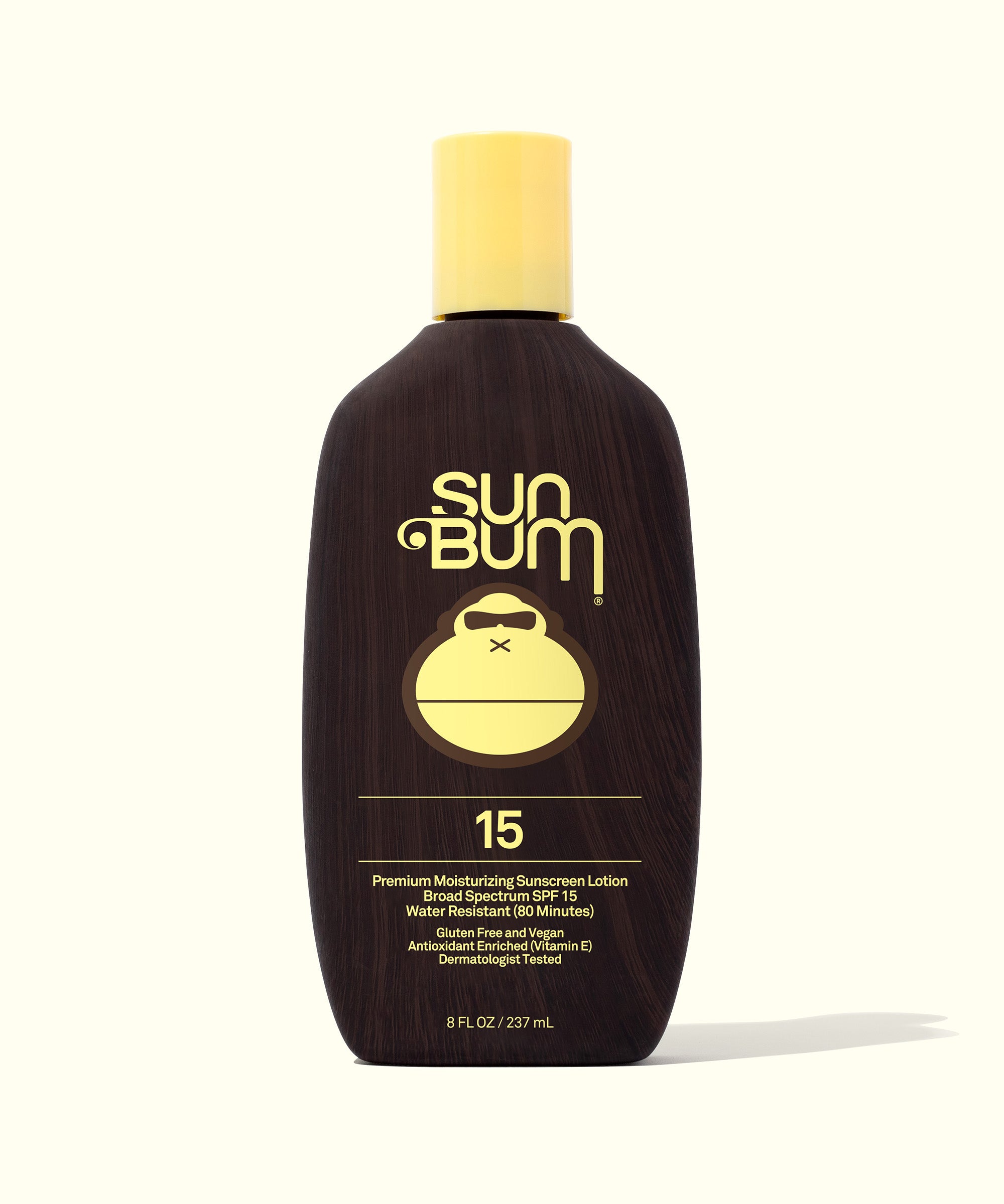 Bottle of Original SPF 15 Sunscreen Lotion with yellow cap and Sun Bum logo on front, Sun Bum.