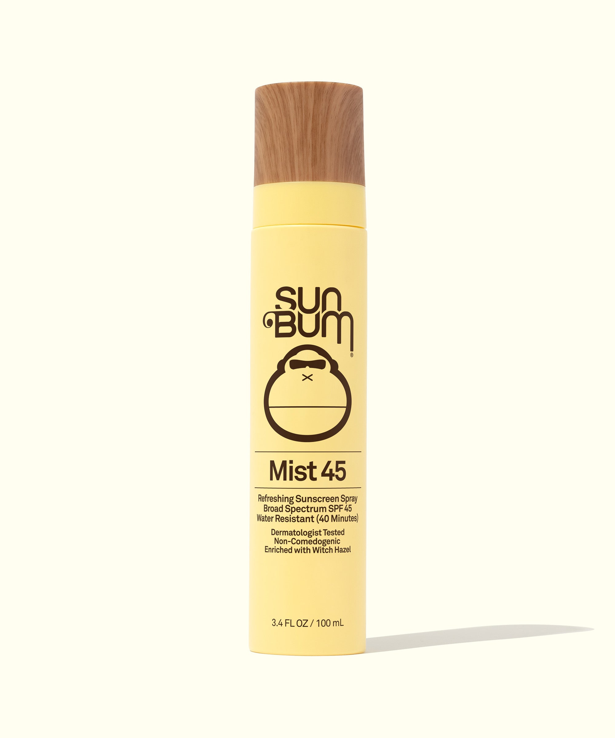 SPF 45 Sunscreen Face Mist bottle with yellow packaging and wooden cap, offering lightweight, sheer sun protection for everyday use. Sun Bum.