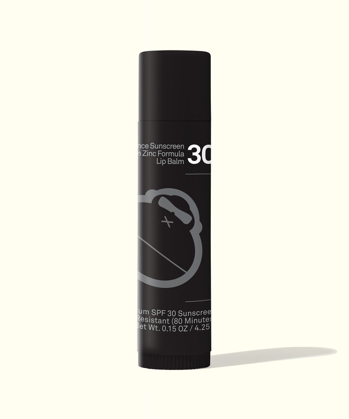 Signature SPF 30 Sunscreen Lip Balm in black tube, mineral-based protection for active sun exposure - Sun Bum