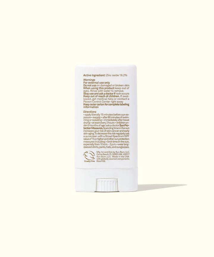 Back view of Mineral SPF 50 Sunscreen Face Stick packaging detailing ingredients and usage instructions. Travel-friendly, fragrance-free zinc-based protection. Sun Bum