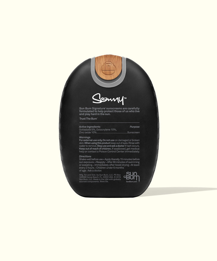 Mineral-based Signature SPF 50 Sunscreen Lotion in a sleek black bottle with a wood-textured cap offering Broad Spectrum protection, perfect for those active in the sun. Sun Bum.