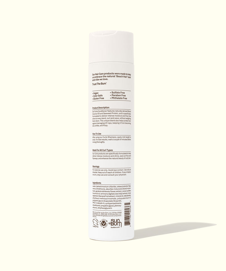 Back view of a white bottle of Curls Conditioner featuring ingredients and usage instructions. Ideal for curly hair, used Kukui Nut Oil and Monoi Coconut Oil. Sun Bum.