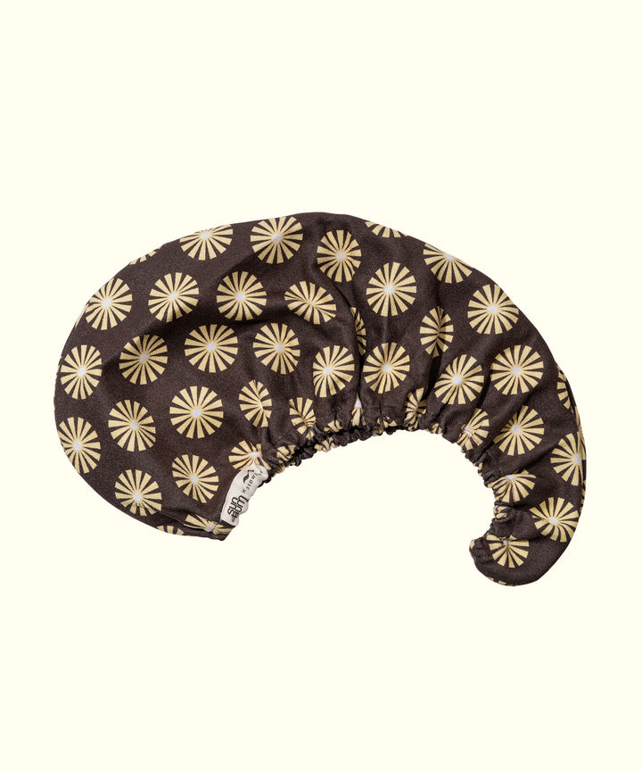 Limited edition SB x Slowtide hair towel designed to dry hair faster and protect against frizz, breakage, and dullness. Sun Bum