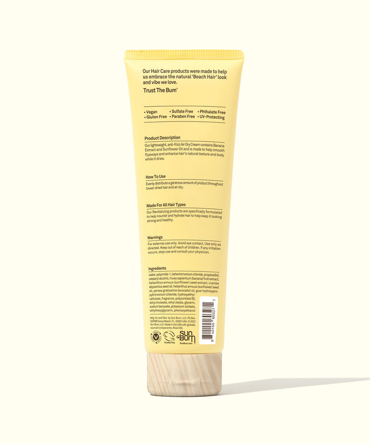 Back view of the yellow tube of Revitalizing Air Dry Cream with product information, highlighting natural ingredients like Banana and Sunflower Oil for anti-frizz and enhancing hair texture, Sun Bum.