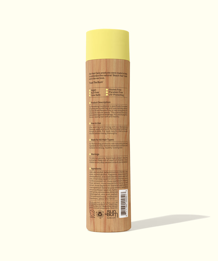 Back view of the Revitalizing Conditioner bottle, showcasing its hydrating formula that includes Coconut Oil, Banana, and Sunflower Seed Oil for smooth, healthy-looking hair. Sun Bum,