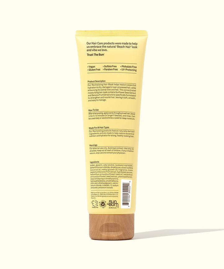 Back view of a yellow tube of Revitalizing Hair Mask by Sun Bum, designed to nourish dry, damaged, and over-processed hair, making it softer, smoother, and easier to manage.
