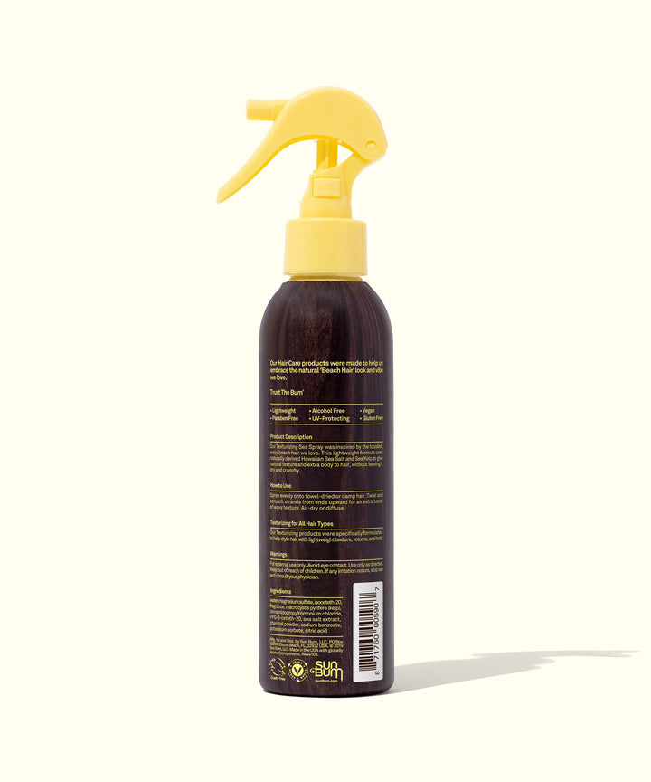 A bottle of ocean-inspired texturizing spray with Hawaiian sea salt and sea kelp for that beachy look, made by Sun Bum.