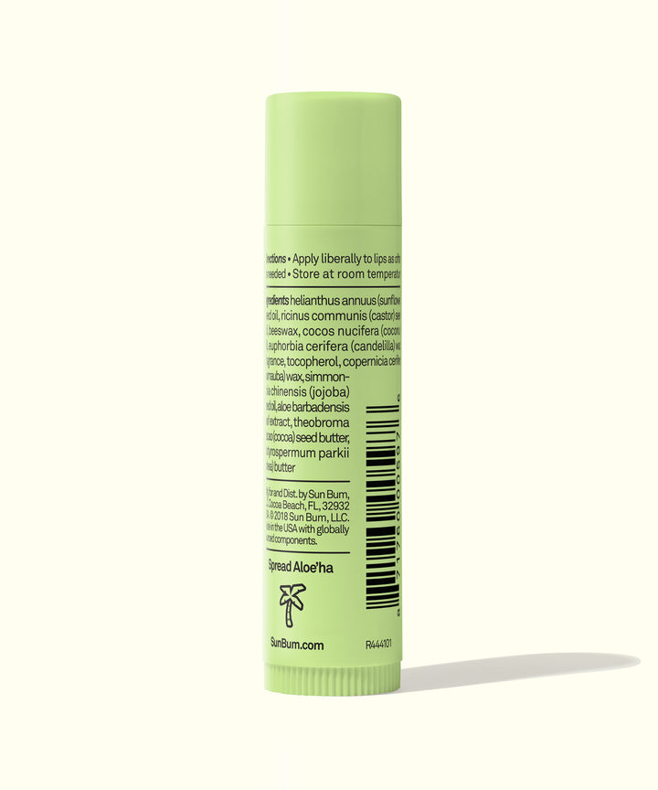 Green tube of CocoBalm Lip Balm - Aloe Wave with ingredient list and directions on the back, by Sun Bum.