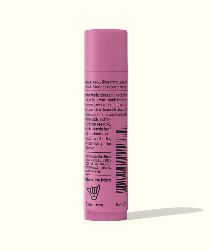 Pink tube of CocoBalm Lip Balm in Groove Cherry flavor by Sun Bum.