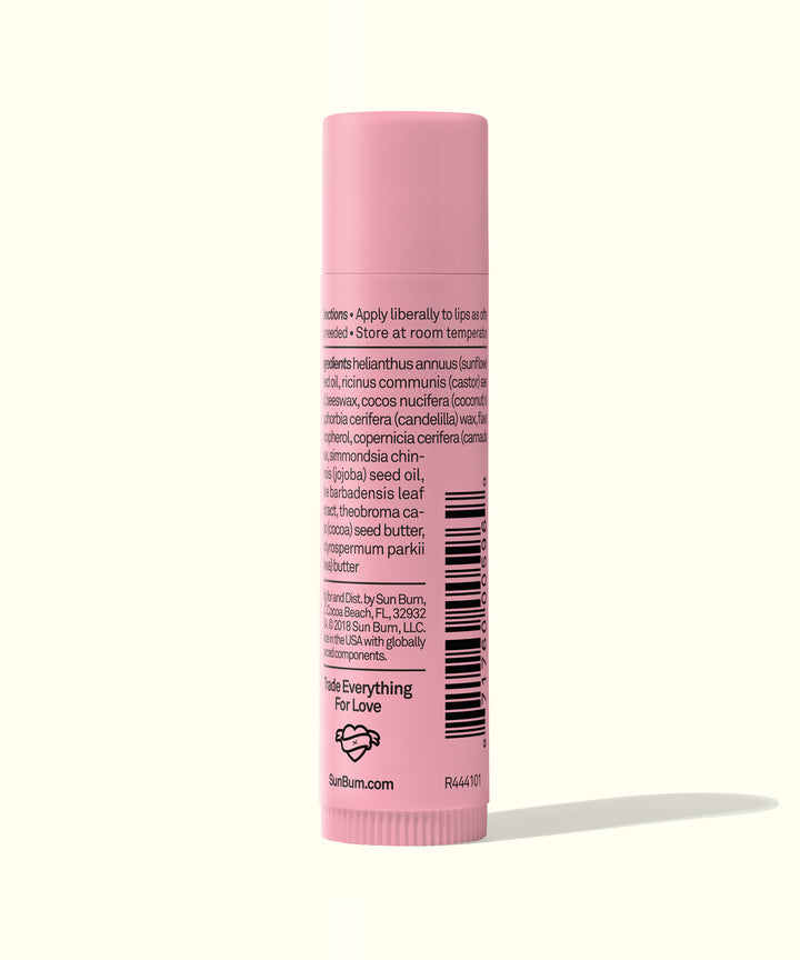 CocoBalm Lip Balm - Wild Strawberry in a pink tube with product details and ingredients listed on the back. Sun Bum