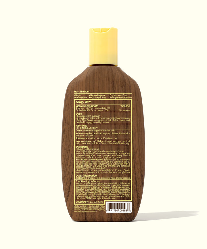 Back view of the Original SPF 30 Sunscreen Lotion bottle with a brown, wood-inspired design and yellow cap, showcasing detailed ingredients and drug facts. Sun Bum