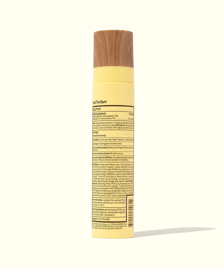 SPF 45 Sunscreen Face Mist with sheer, lightweight sun protection in a yellow bottle with a wooden cap. Sun Bum.