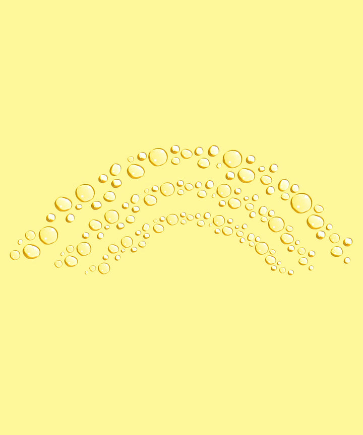 Yellow background with arranged droplets showcasing Daily Sunscreen Face Mist SPF 30 by Sun Bum.