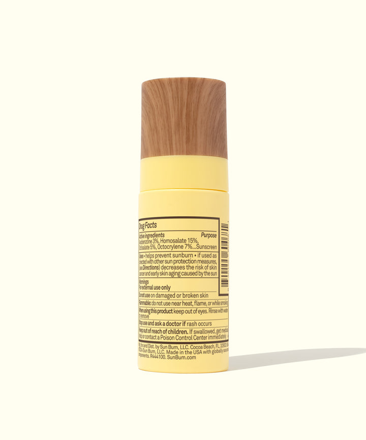Yellow bottle of Original SPF 45 Sunscreen Face Mist with wooden cap by Sun Bum,