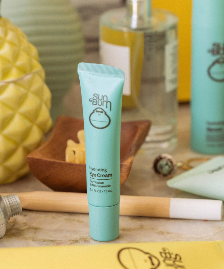 Hydrating Eye Cream with Vitamin C enriched Rambutan and Niacinamide in a turquoise tube by Sun Bum.