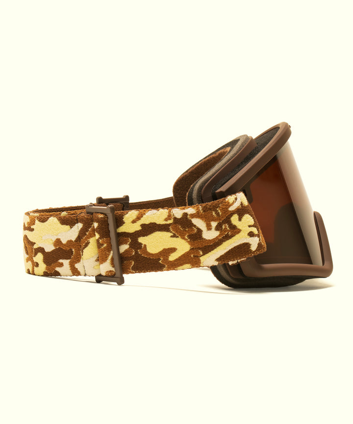 Sun Bum X Electric Goggles featuring brown tinted lenses with desert camo patterned straps, designed for superior mountain visibility and style with adjustable comfort fit - by Sun Bum